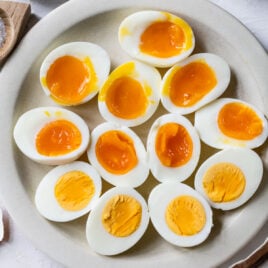 a plate with instant pot boiled eggs: 5-5-5 hard boiled, jammy eggs, and instant pot 2 minute eggs