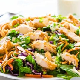 Copycat Applebee’s Oriental Chicken Salad. A better homemade version of the original restaurant recipe anyone can make! Juicy oven fried chicken, fresh greens, crispy ramen noodles in a sweet and tangy oriental dressing. Recipe at wellplated.com | @wellplated