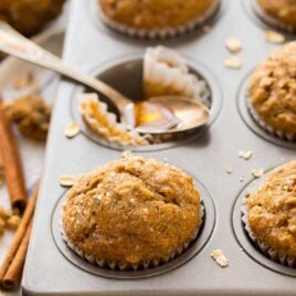 A delicious and healthy recipe for Applesauce Muffins with oatmeal, cinnamon, and honey. Healthy, tasty muffins with no sugar and no butter! The perfect healthy muffins for kids and grown-ups too!