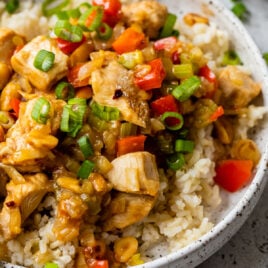 a bowl of authentic kung pao chicken with rice