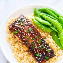 Easy Soy Ginger Salmon – a quick and easy recipe for busy weeknight dinners. Simple baked salmon, topped with a honey soy ginger glaze. Recipe at wellplated.com | @wellplated