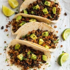 Quick and easy Tofu Tacos with black beans. Crispy, lightly spicy, and delicious! A high protein vegetarian meal that's ready in less than 30 minutes.