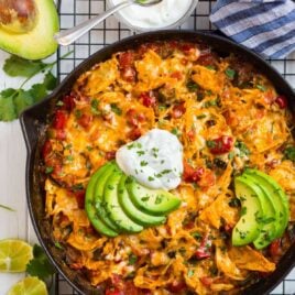 A skillet of king ranch chicken with avocado