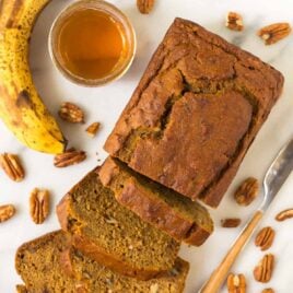 Healthy Pumpkin Banana Bread! Moist and tender with the perfect amount of spices. Easy one bowl recipe that’s delicious with chocolate chips, nuts, or any of your favorite mix-ins.