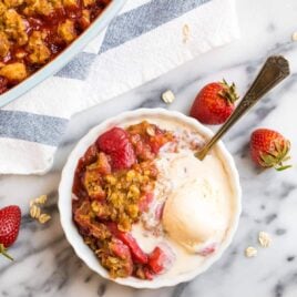 Easy Strawberry Crisp with healthy Oat topping and vanilla ice cream.