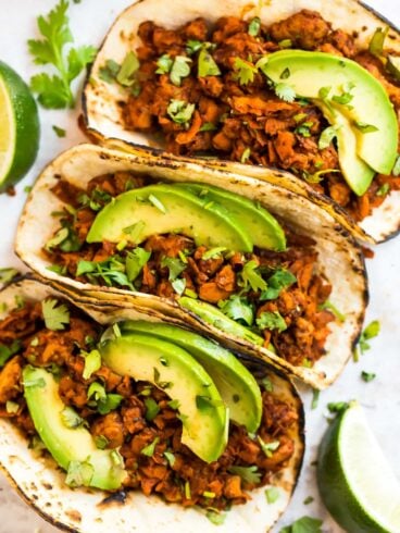Tempeh tacos topped with avocado slices