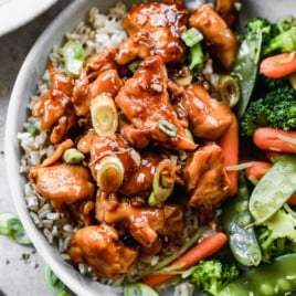 the BEST teriyaki chicken recipe in a bowl with rice and veggies