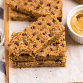 a stack of Vegan Protein Bars made with oats, dates, and peanut butter with chocolate chips