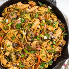 Chicken and noodle stir fry in a skillet