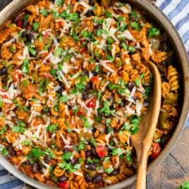 Healthy Taco Pasta with Twirly Noodles, Cheese, and Chicken in a Skillet