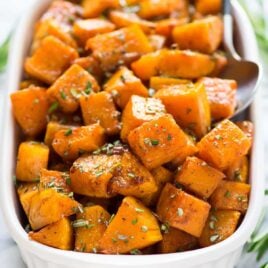 Easy Maple Cinnamon Roasted Butternut Squash. Sweet cubes of butternut squash tossed with maple syrup, cinnamon, and rosemary, roasted to caramelized perfection. Our family’s favorite Thanksgiving, Christmas, or any time you need a simple and healthy weeknight side.