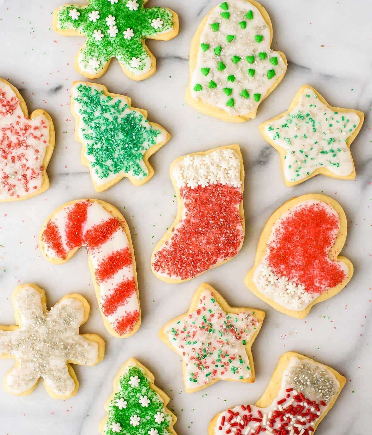 Soft and fluffy Cream Cheese Sugar Cookies with Perfect Icing. The only cut out cookie recipe you will ever need!