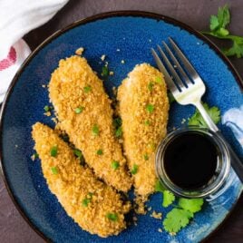 Oven baked Crispy Asian Chicken Tenders. Juicy, crispy, sweet, and spicy with a golden panko crust. Easy, healthy, and SO much better than take out! Recipe at wellplated.com | @wellplated
