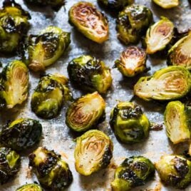 Roasted Brussels sprouts halves on a baking sheet