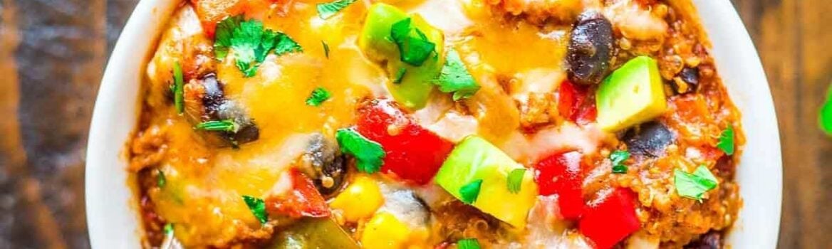 bowl of Crock Pot Mexican Casserole topped with melted cheese