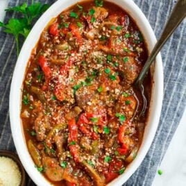 Crock Pot Sausage and Peppers. Flavorful and tender in a rich tomato sauce! Serve with pasta, use to make sandwiches, or enjoy over cauliflower rice for low carb dinners.