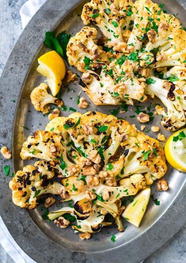 Grilled Cauliflower Steaks with lemon, garlic, and toasted walnuts