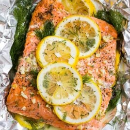 Grilled Salmon in Foil topped with lemon, dill, garlic, and butter