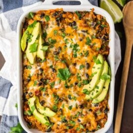 A healthy, easy Mexican chicken casserole recipe your entire family will love! Made with quinoa, fresh veggies, black beans, and cheese, this creamy, cheesy Mexican casserole has received dozes of glowing reviews!