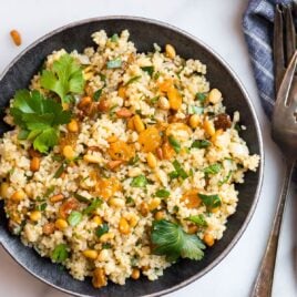 Moroccan couscous with raisins, spices, pine nuts, and fresh herbs