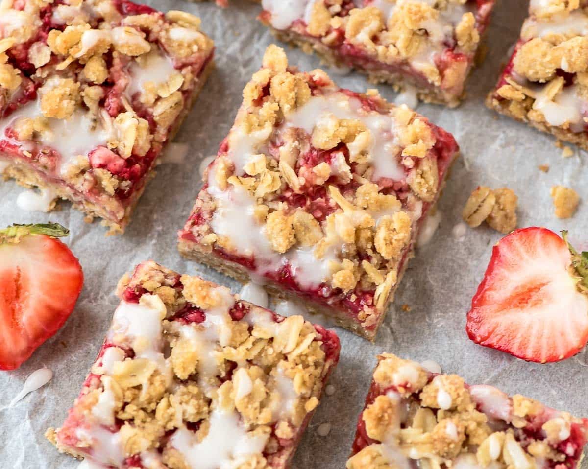 Strawberry Oatmeal Bars recipe — So easy, kids can make them! With 100% whole grains and the natural sweetness of strawberries, these simple one-bowl crumb bars are healthy enough for a snack but sweet enough for dessert. @wellplated