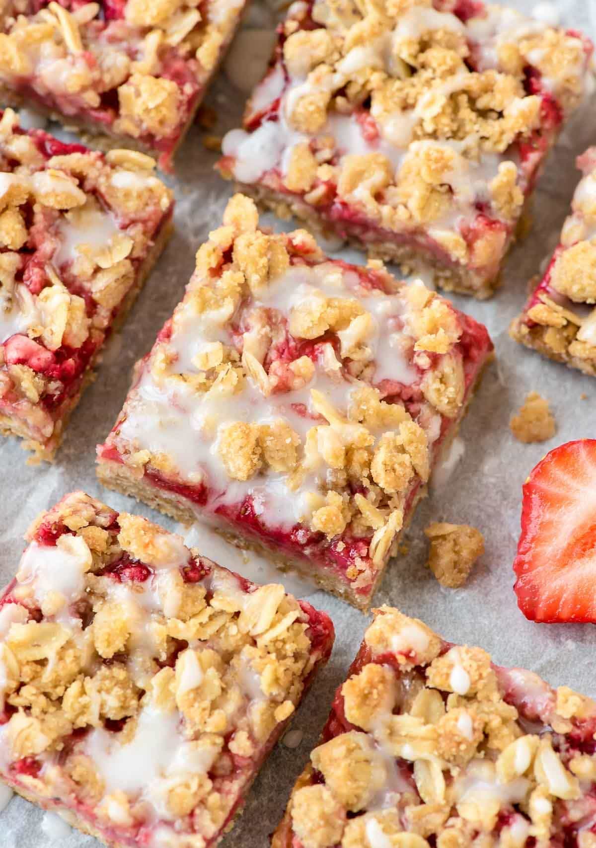  These easy Strawberry Oatmeal Bars, with a buttery crust, fresh strawberry filling, and sweet vanilla glaze make wonderful dessert bars to take to a party or potluck. Made with 100% whole grains, they healthy enough for an afternoon snack but sweet enough for dessert! @wellplated