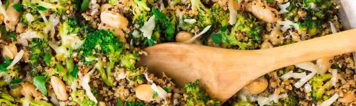 One Pan Cheesy Broccoli Quinoa Skillet with Parmesan and White Beans. An easy and filling vegetarian recipe that's great for quick dinners and healthy meal prep lunches.