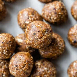 healthy Fig and Date Energy Balls stacked in a pile
