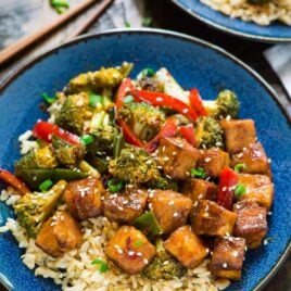 General Tso Tofu. A healthy, DELICIOUS version of everyone’s favorite takeout dish. Easy and made with everyday ingredients. Filled with fresh veggies and protein, in the most flavorful General Tso’s sauce. ONE PAN, vegan, and gluten free!