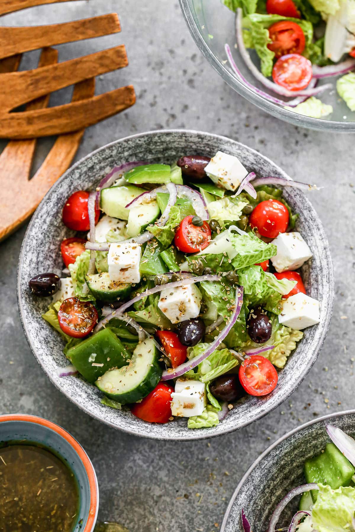 A bowl of Greek salad with lettuce