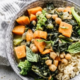 Easy Thai Chickpea Curry with sweet potato, kale, and coconut milk. Not too spicy, healthy, and made with easy to find ingredients! Super tasty and ready in 30 minutes, so it’s perfect for fast weeknight dinners. Vegan and gluten-free friendly recipes that's great leftover too!