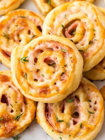 Easy Ham and Cheese Pinwheels with Puff Pastry. Just FOUR ingredients! Everyone loves this simple and delicious appetizer recipe. Easy to make ahead and perfect for holiday parties too! Recipe at wellplated.com | @wellplated