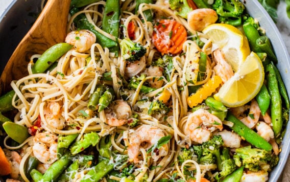 An easy, healthy Lemon Garlic Shrimp Pasta with Parmesan. Frozen stir fry veggies make this recipe extra quick with minimal prep. Ready in 30 minutes and a total crowd pleaser! Simple, lightly spicy, and perfect for date night or easy healthy dinners.