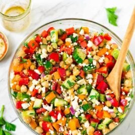 Healthy Mediterranean Chickpea Salad with feta, cucumber, bell peppers, and a simple Greek dressing. Fast, easy recipe that’s perfect for a summer barbecue side dish or a main dish salad for a light dinner. {vegetarian, gluten free, vegan friendly} Recipe at wellplated.com | @wellplated