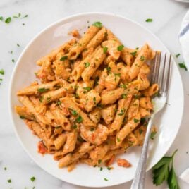 Healthy Penne Alla Vodka with Chicken. BEST RECIPE! A lighter version of classic vodka sauce made with tomatoes and almond "cream." Dairy free and delicious!