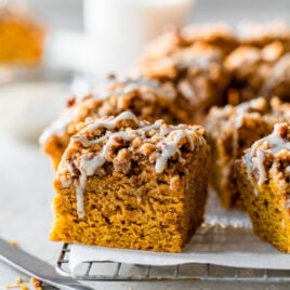 A slice of moist Pumpkin Coffee Cake with Streusel Topping and Maple Glaze