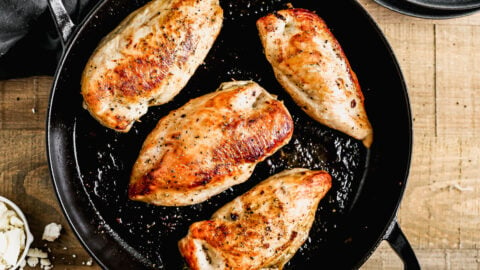 Spinach stuffed chicken breasts in a skillet