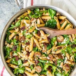 Sun Dried Tomato Pasta with Spinach, Sausage, and White Beans - A super easy pasta dish with the most amazing flavor, ready in 20 min! @wellplated
