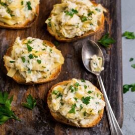The best easy crab appetizers! Creamy crab and artichoke, served on top of baguette slices, phyllo cups, or crackers. Enjoy warm or cold. Great for Christmas parties, New Year's Eve, or anytime you need a fast but delicious appetizer recipe.