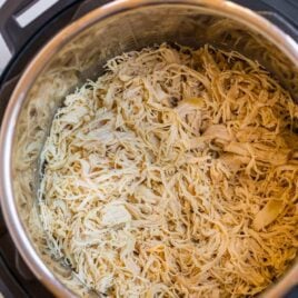 An Instant Pot with shredded chicken