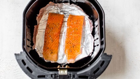 Two pieces of fish on foil