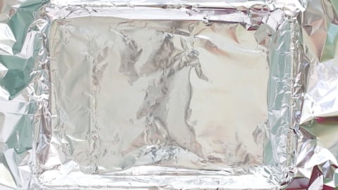 lining foil on a baking sheet