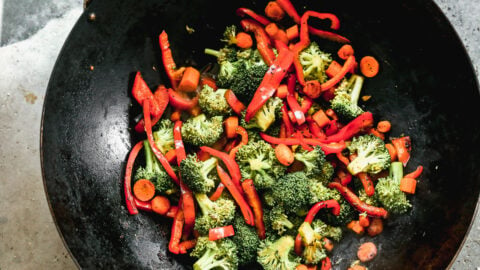 broccoli and vegetables for beef lo mein in a skillet