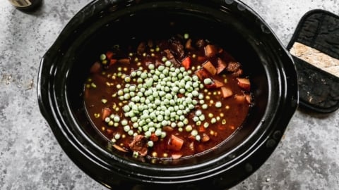 adding frozen peas to crockpot beef stew