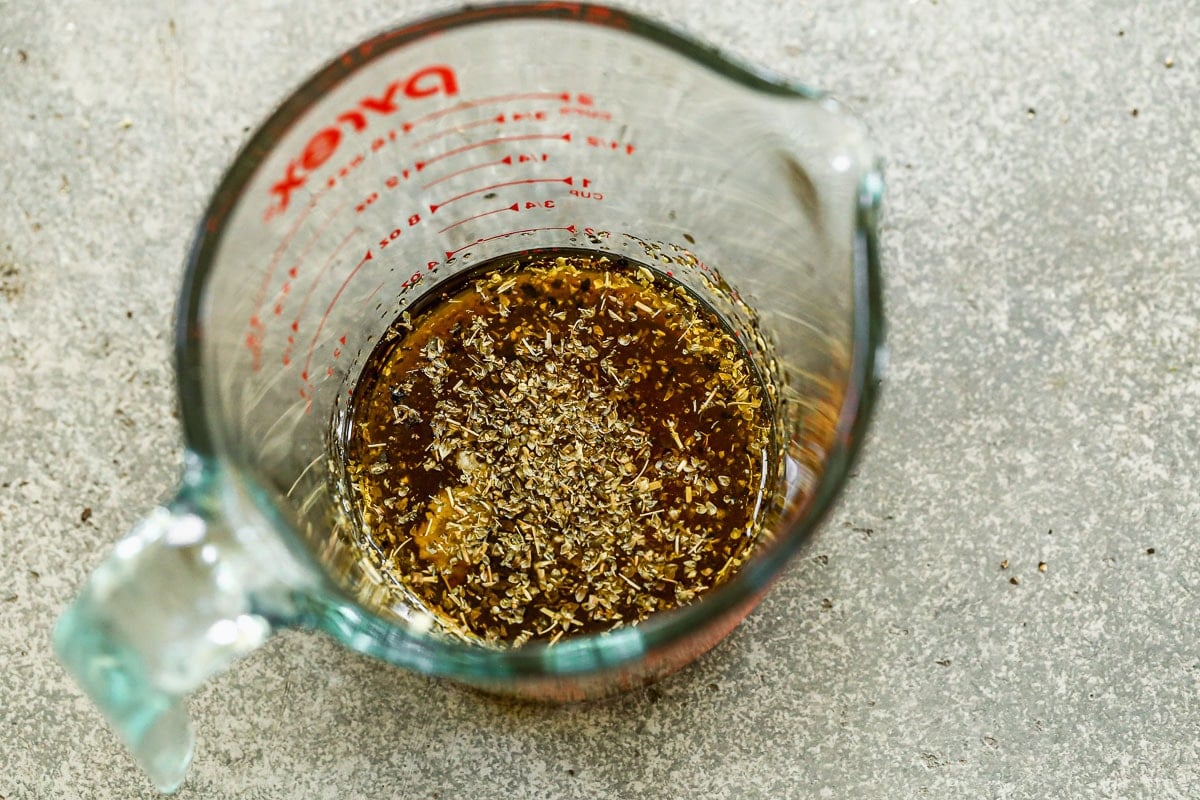 Salad dressing in a measuring cup