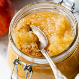 A spoon scooping out Instant Pot applesauce