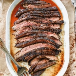 a large platter of grilled flank steak recipe