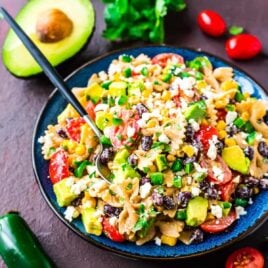 Creamy Mexican Pasta Salad with corn, black beans, avocado, and a delicious Greek yogurt dressing made with chili and lime juice. Easy, healthy, and always a favorite! Perfect picnics, potlucks, or a light summer dinner. Recipe at wellplated.com | @wellplated