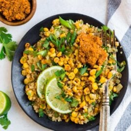 Healthy Mexican Street Corn Salad on a plate with lime