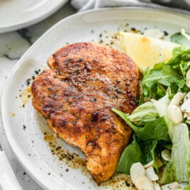 Healthy pan fried chicken breast with salad